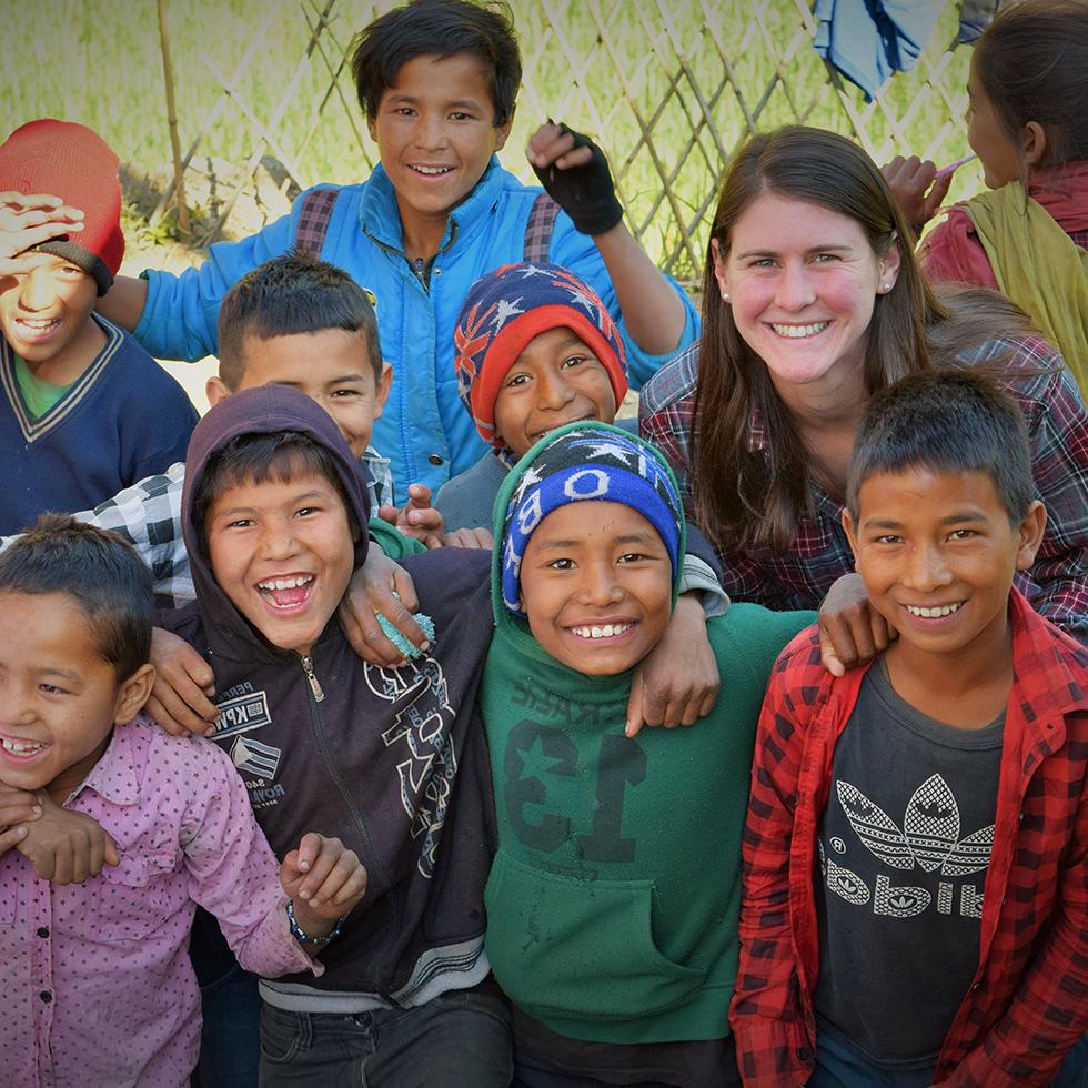 Student with a group of children